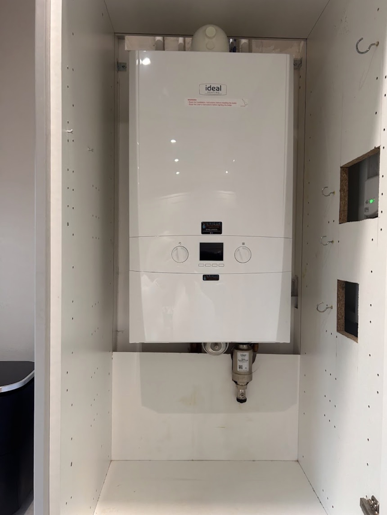 Neat Ideal boiler cupboard installation in Hull
